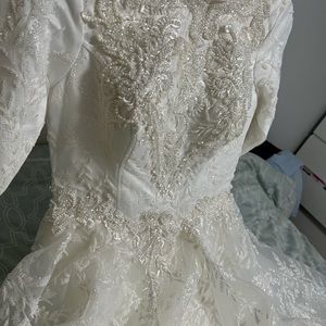Brand new custom ordered wedding dress. Long sleeve.